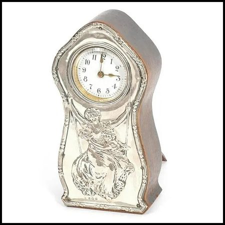 English Art Nouveau clock in Sterling and wood.