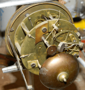 An antique French clock may have a maker's name on the mechanism.