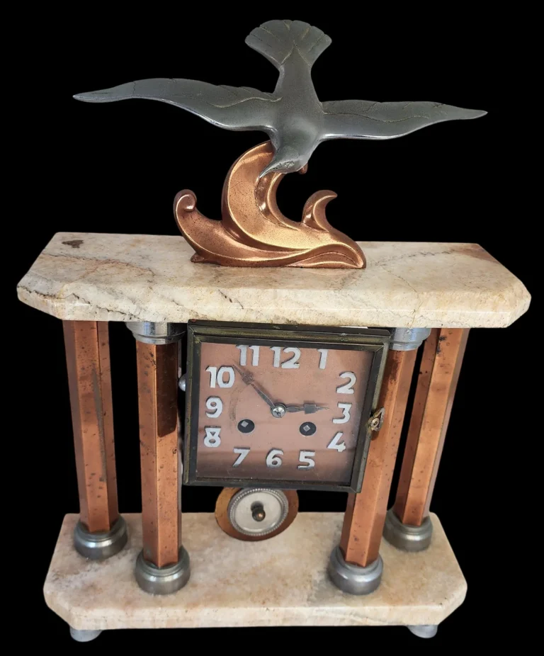An antique old clock that is a stunning Art Deco clock by Michel Decoux. This is a valuable clock due to the maker of it.