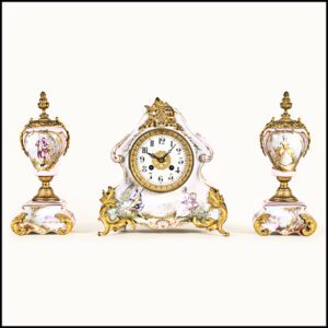Marti mantel clock in porcelain with twin garnitures. This is one of our old antique clocks for sale.