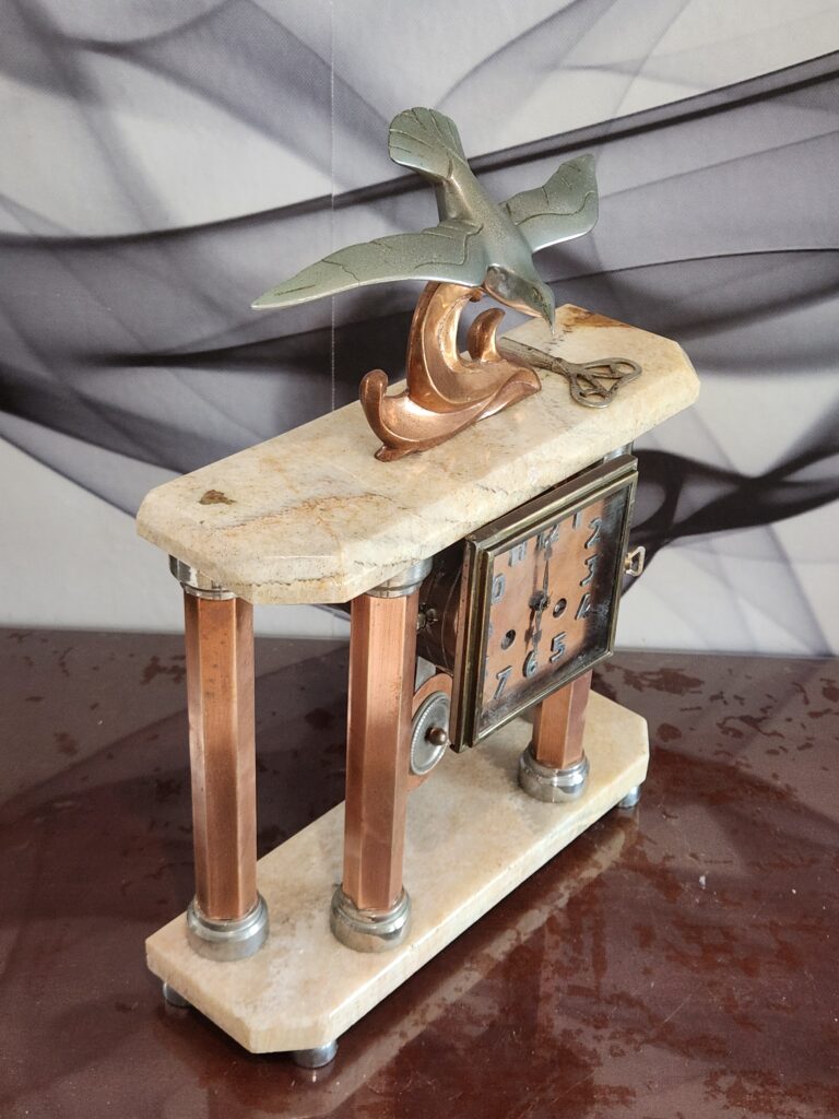 A vintage clock from the Art Deco Period by Decoux. When hunting for vintage mantel clocks, Decoux is maker to seek.